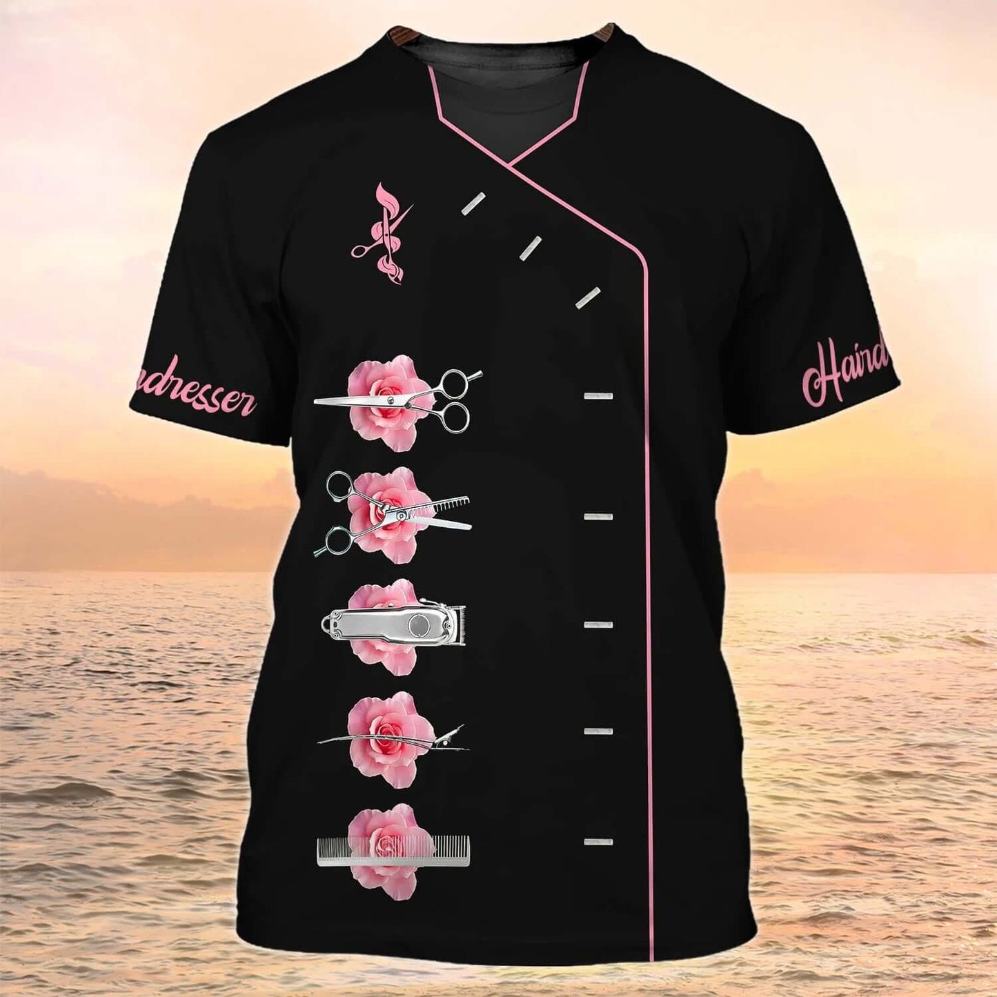 Black hairdresser tee with pink floral design and salon tools against a sunset background.