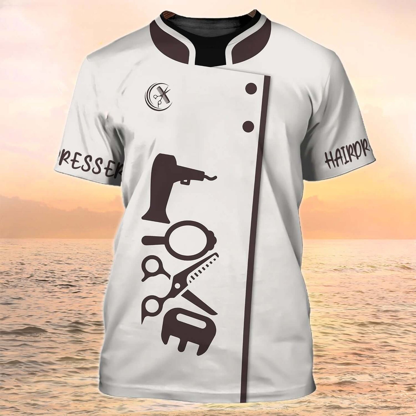 Stylish salon tee with hairdressing tools print, ideal for beauty aesthetics professionals on a scenic beach background.