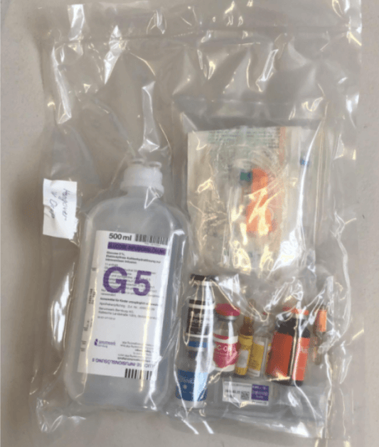 IV drip kit with G5 solution and various medical supplies in a clear plastic bag for beauty and aesthetics use.