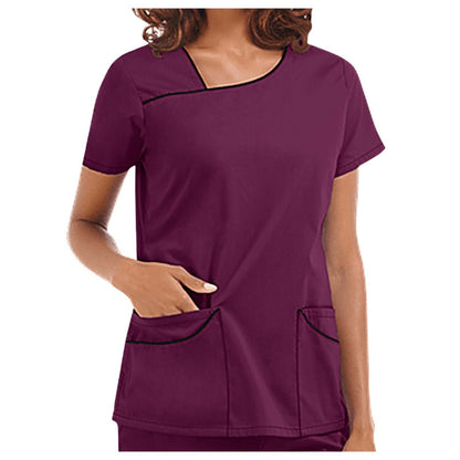 Short sleeve V-neck beauty spa uniform in deep burgundy, featuring practical front pockets for aesthetics professionals.