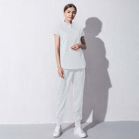 Fashionable white salon workwear for women, perfect blend of style and comfort for the beauty aesthetics industry.