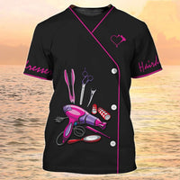 Black salon tee with hairdressing tools design and pink accents for beauty aesthetics professionals